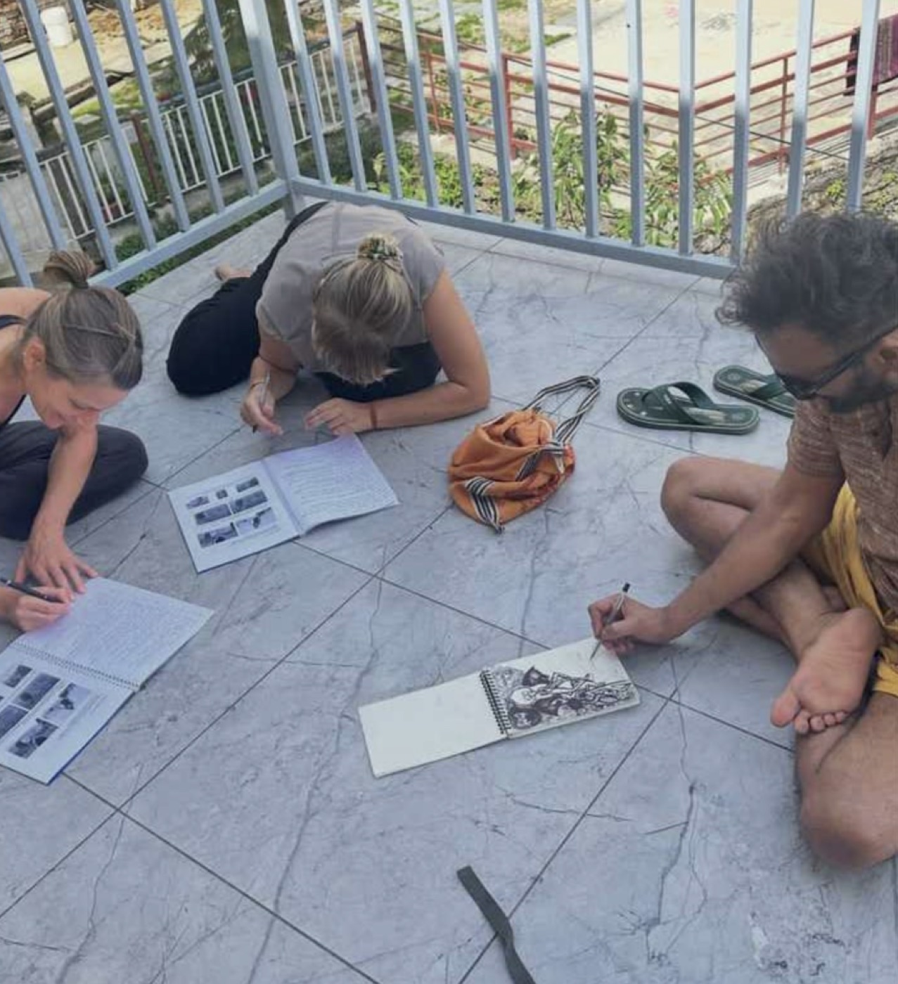 Students studying anatomy together on the terrace
