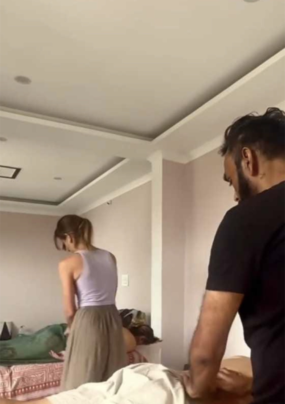 Jai Dev guiding a student during hands-on practice